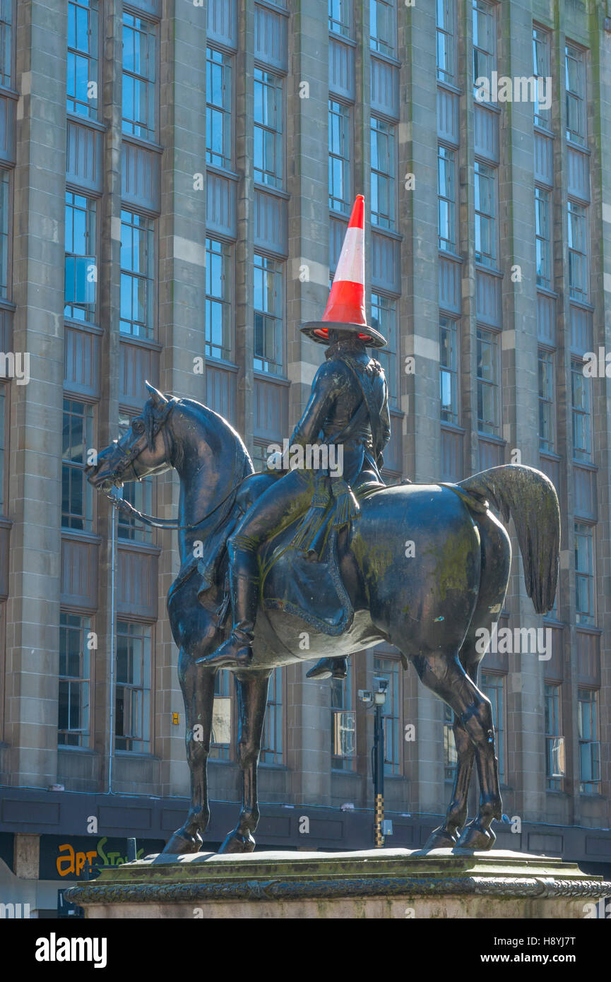 The statue of the Duke of Wellington outside the Glagow Museum of Art. The statue always has a traffic cone placed on its head. Stock Photo