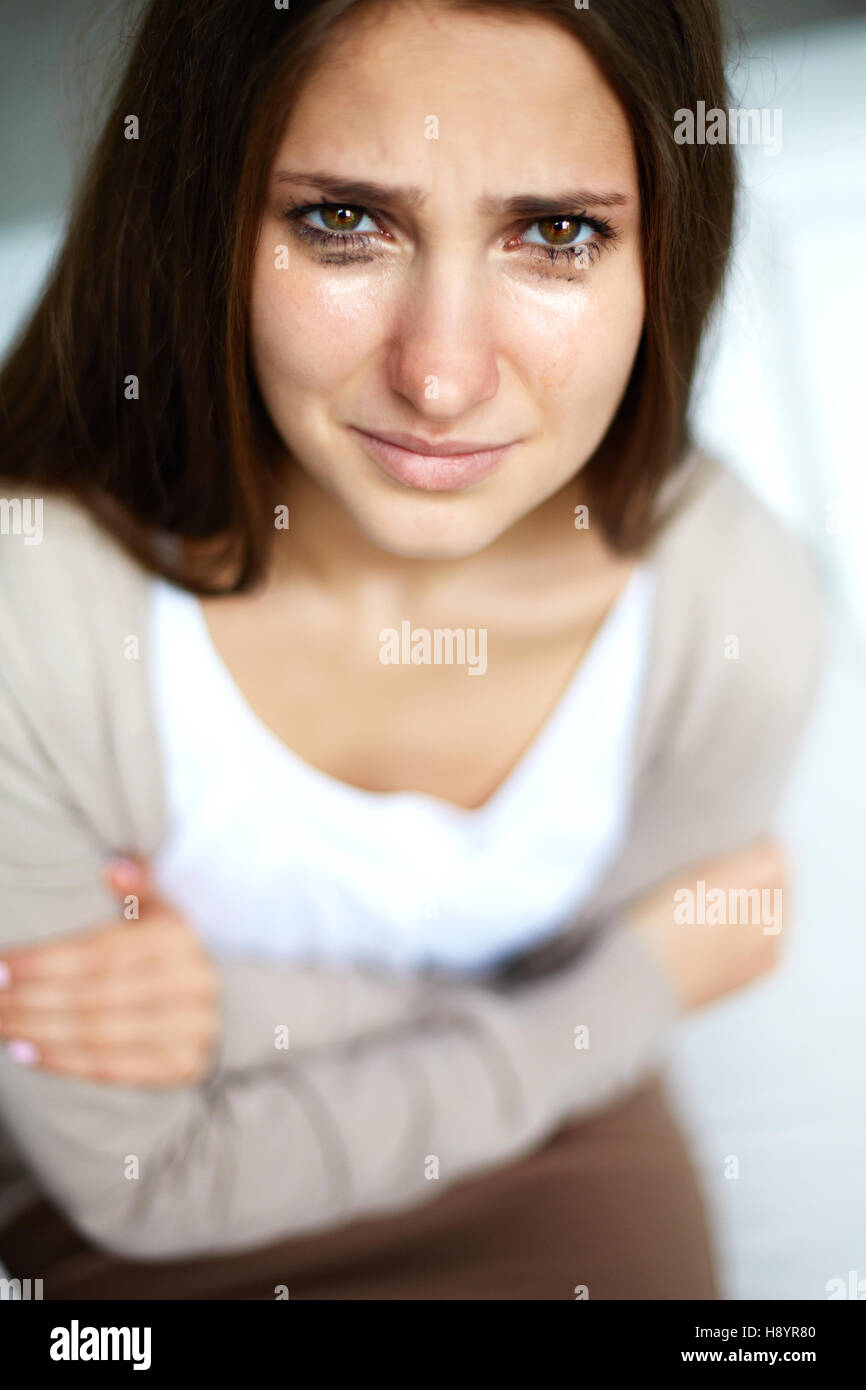 Crying girl looking at camera Stock Photo