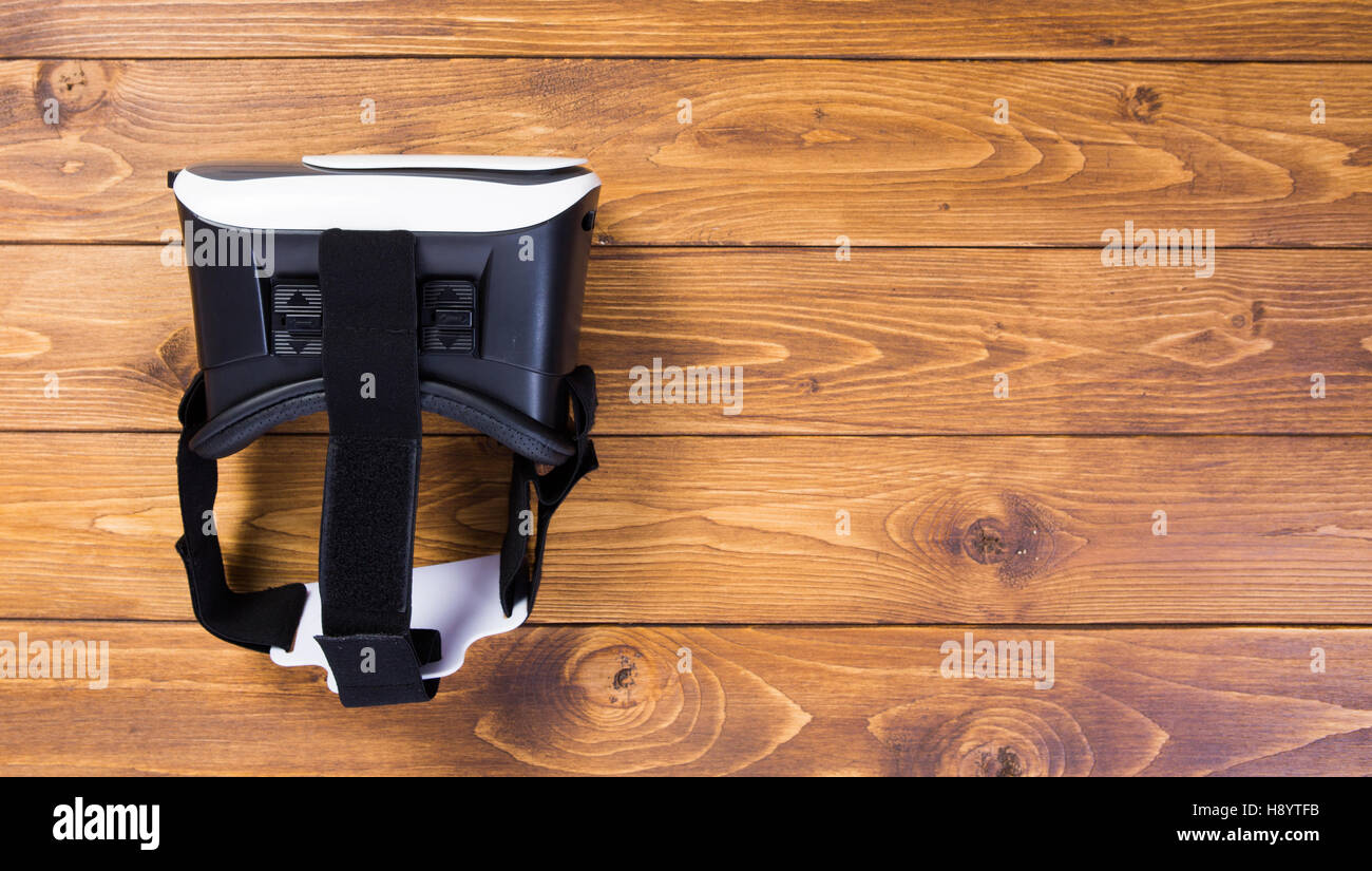 back side of a vr headset, isolated on wooden floor background Stock Photo