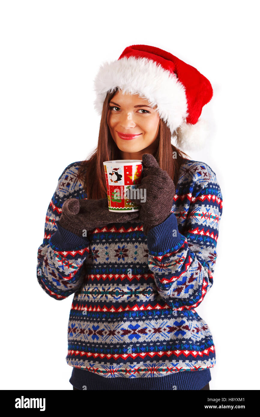 Beautiful young girl wearing sweater, gloves and Santa's hat, holding  christmas cup, looking at camera Stock Photo - Alamy