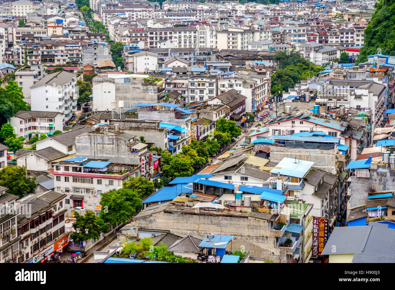 YANGSHUO, CHINA - JUNE 12: View over rooftops and buildings of Yangshuo city, Guilin prefecture. June 2016 Stock Photo