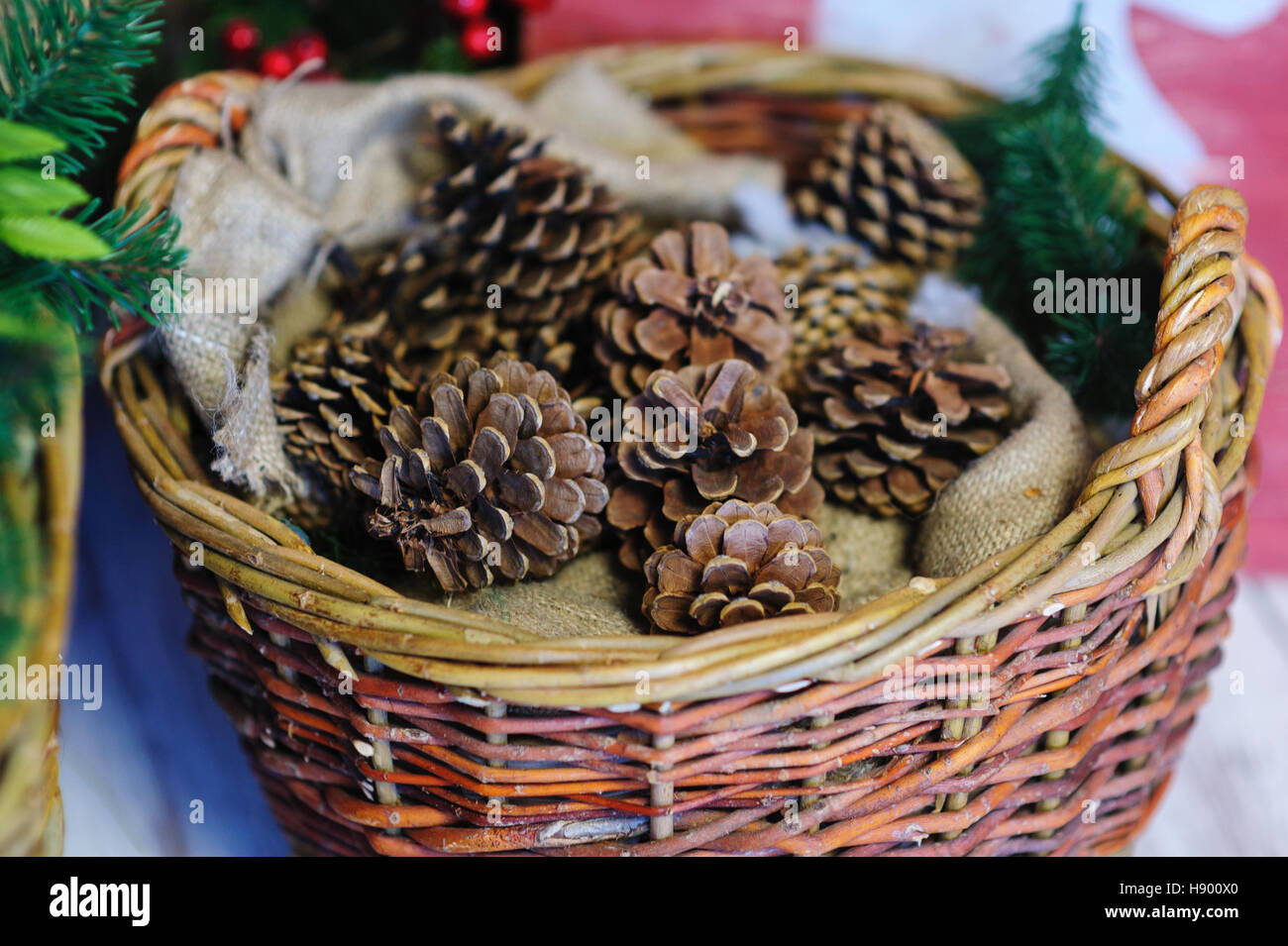 pine cones in a basket. Christmas Decor Stock Photo - Alamy