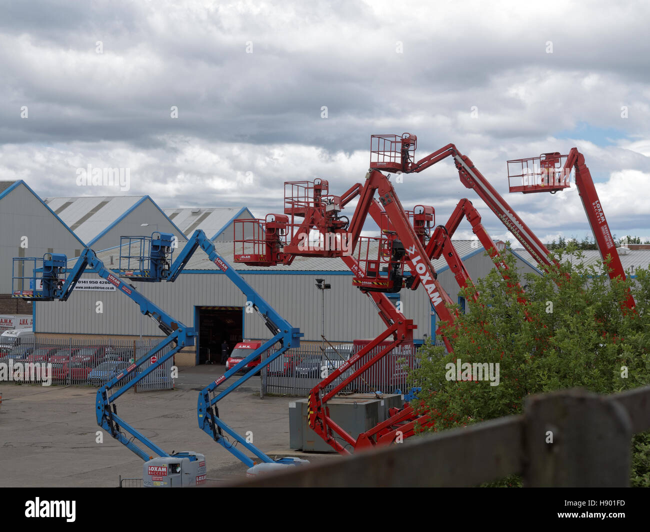 Simon type platforms on yard red blue Stock Photo