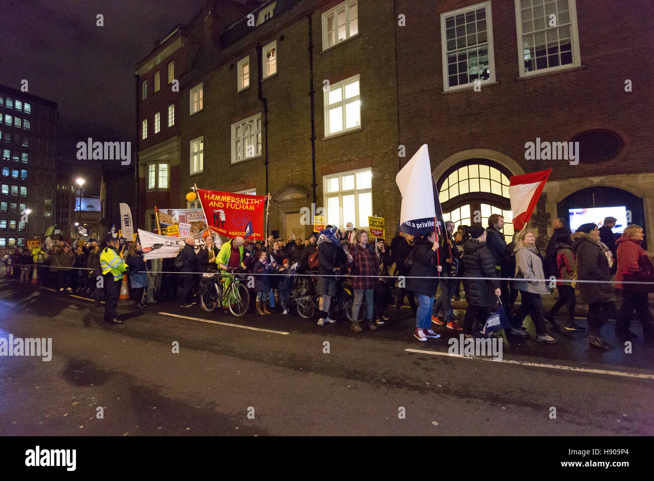 London, UK. 17th Nov 2016. Protesters march past the Department for Education. Teachers from the National Union of Teachers (NUT), school governors and support staff stage a protest rally against government cuts in education funding outside Downing Street in Westminster before marching to the Department for Education this evening. Protesters are demanding and increase in education funding in the upcoming budget to ensure that every child gets the best education. Credit:  Vickie Flores/Alamy Live News Stock Photo