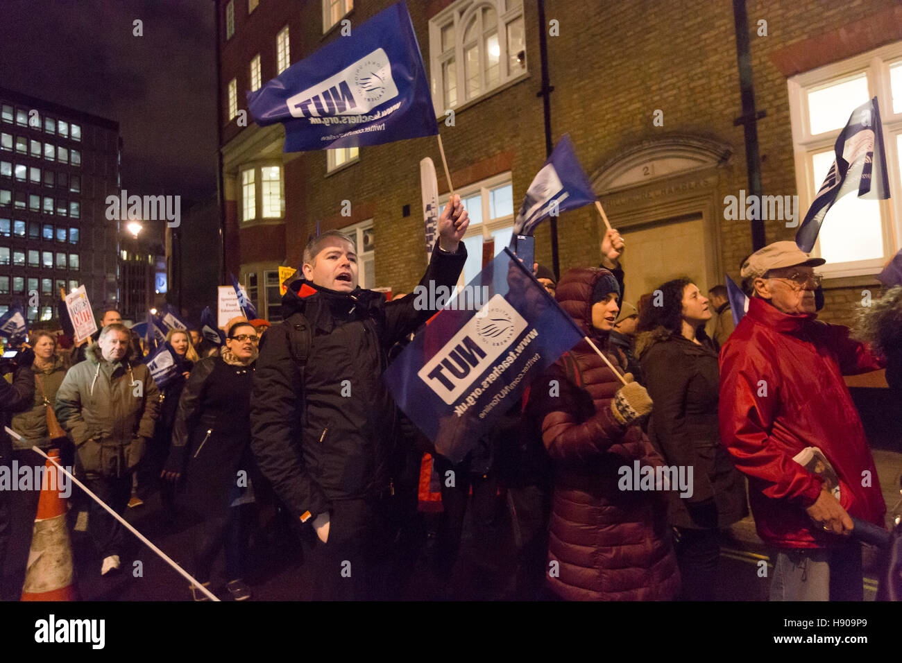 London, UK. 17th Nov 2016. Protesters march past the Department for Education. Teachers from the National Union of Teachers (NUT), school governors and support staff stage a protest rally against government cuts in education funding outside Downing Street in Westminster before marching to the Department for Education this evening. Protesters are demanding and increase in education funding in the upcoming budget to ensure that every child gets the best education. Credit:  Vickie Flores/Alamy Live News Stock Photo