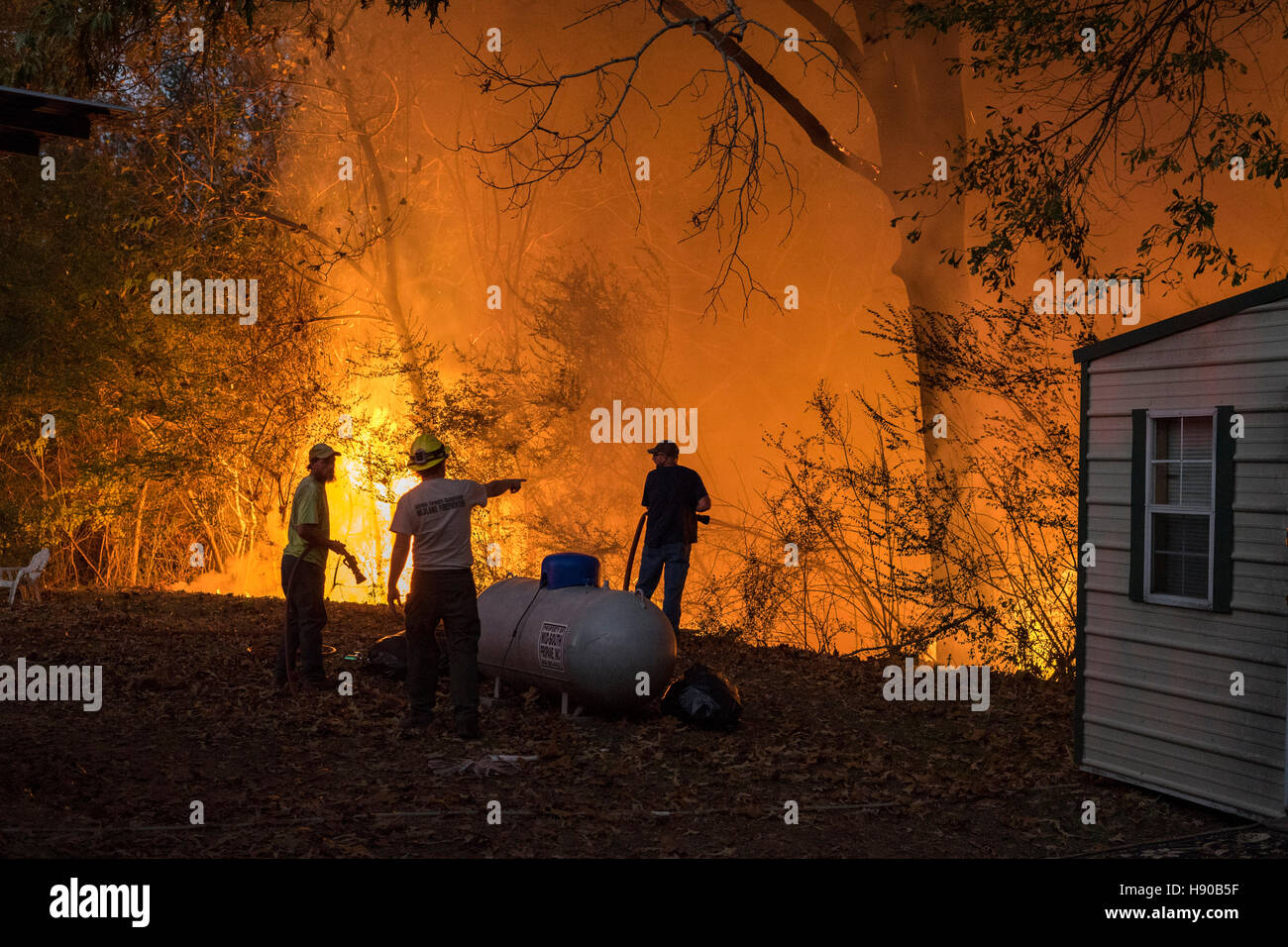 Vernon, USA. 17th Nov, 2016. A debris fire that got out of control Thursday evening, Nov. 17th, brought volunteer firefighters from Vernon and Crossville, Al. out to fight it. The worst drought in recent history has the Alabama woods tinder dry. Credit:  Tim Thompson/Alamy Live News Stock Photo