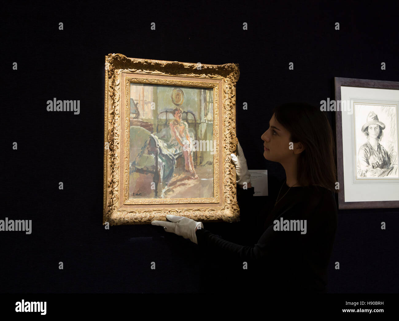 London,UK,21st November 2016,A lady views artwork by Walter Richard Sickert at Bonhams Modern British and Irish art sale in Londo Credit: Keith Larby/Alamy Live News Stock Photo