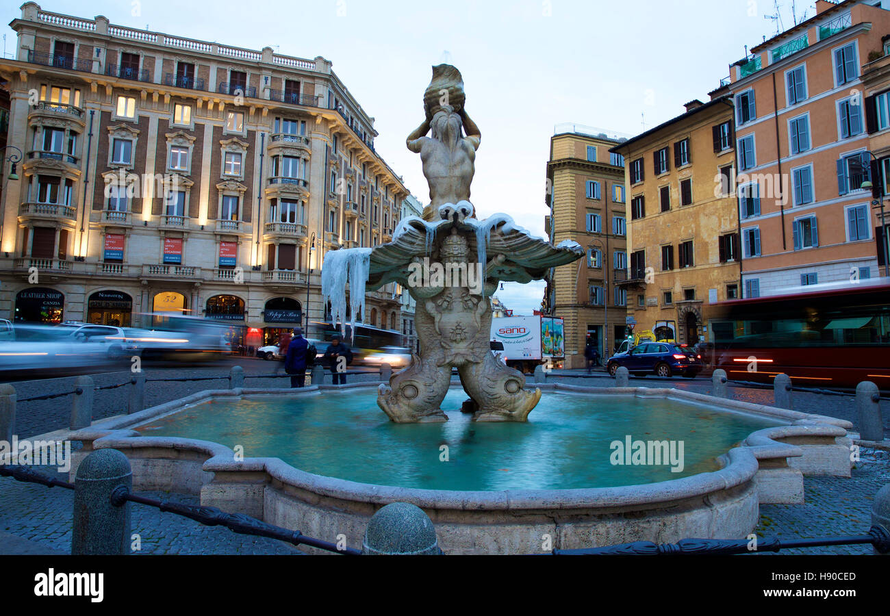 Rome, Italy. 10th Jan, 2017. Photo taken on Jan. 10, 2017 shows the 'Triton Fountain' covered with ice at Piazza Barberini in central Rome, Italy. At least eight people died in Italy, as a wave of cold kept sweeping the country with freezing temperatures and heavy snowfalls on Monday. © Jin Yu/Xinhua/Alamy Live News Stock Photo