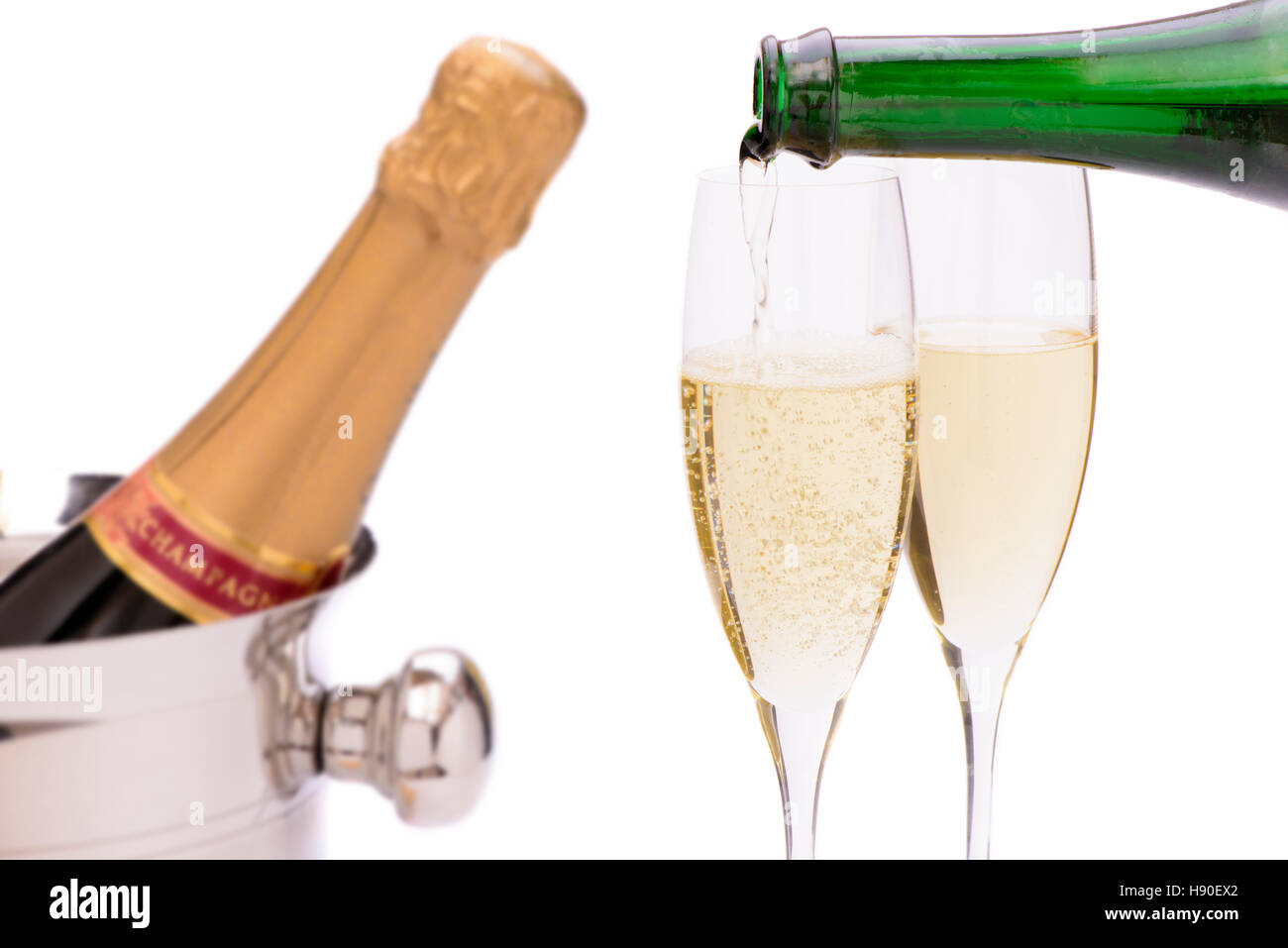 bottle champagne in ice cooler with two glasses Stock Photo