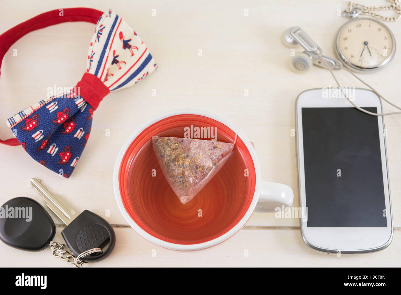 Cup of tea and accessories for a successful day Stock Photo