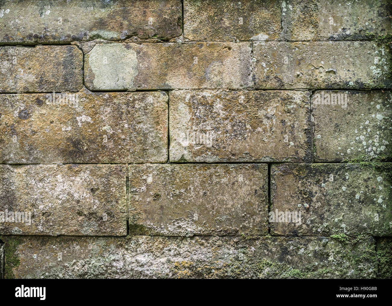 Old stone block wall background. Stock Photo
