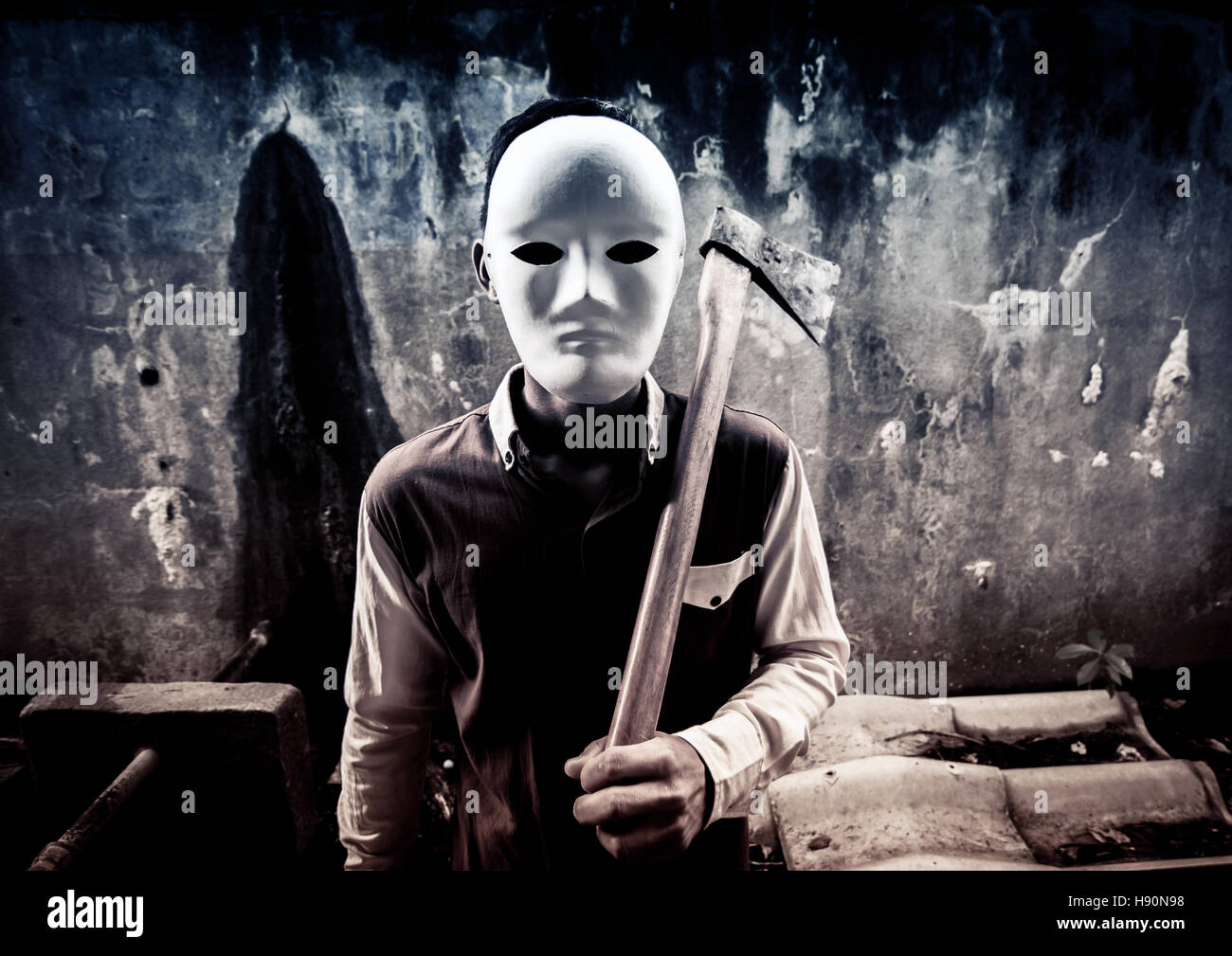 A stranger person with hatchet ,Scary background for book cover ideas Stock Photo