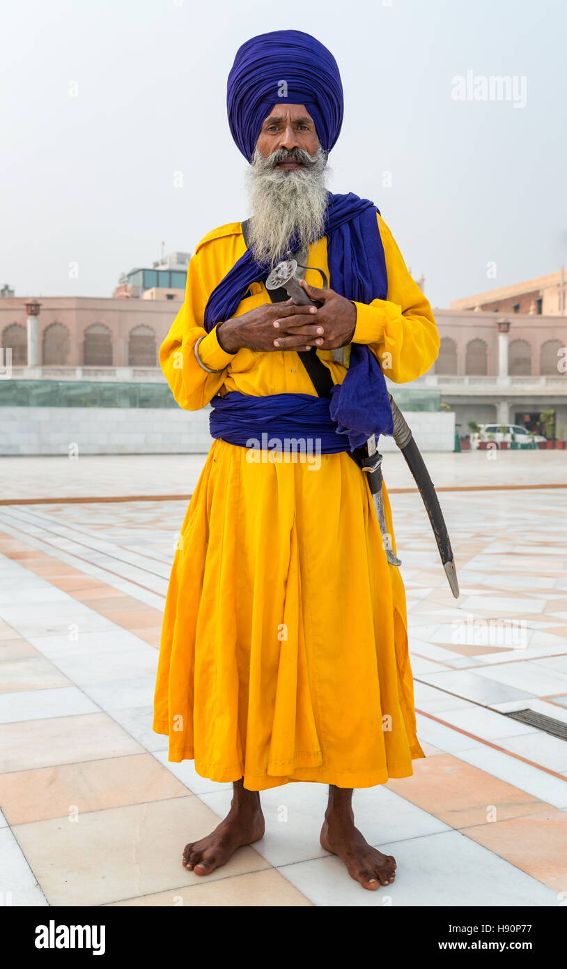 Sikh guard at The Golden Temple Complex in the Sikh city of Amritsar, Punjab, Northern India Stock Photo