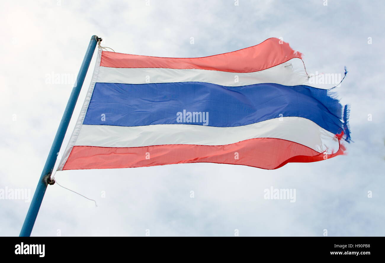 Wavy old Kingdom of Thailand flag against blue sky Stock Photo