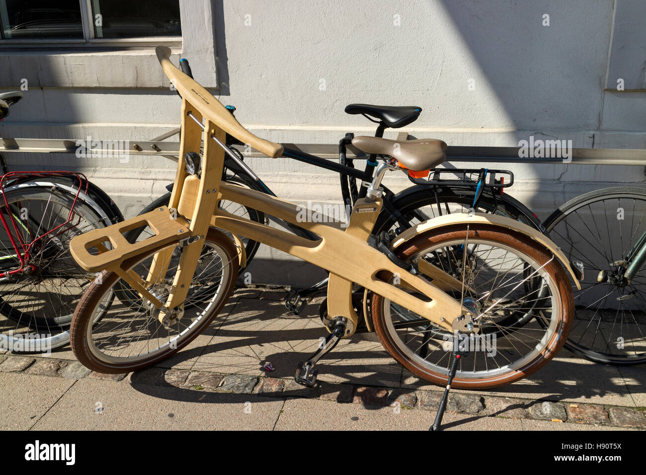 Wooden bicycle on the street Stock Photo