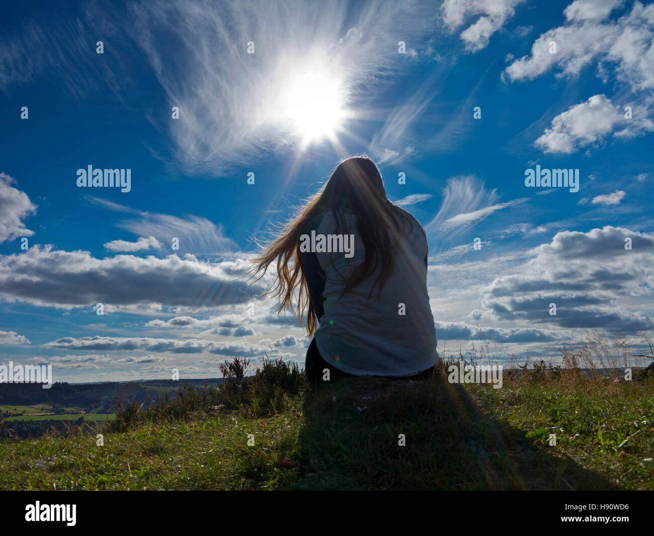 Teenage girl with long hair enjoying a country walk in summer Stock Photo