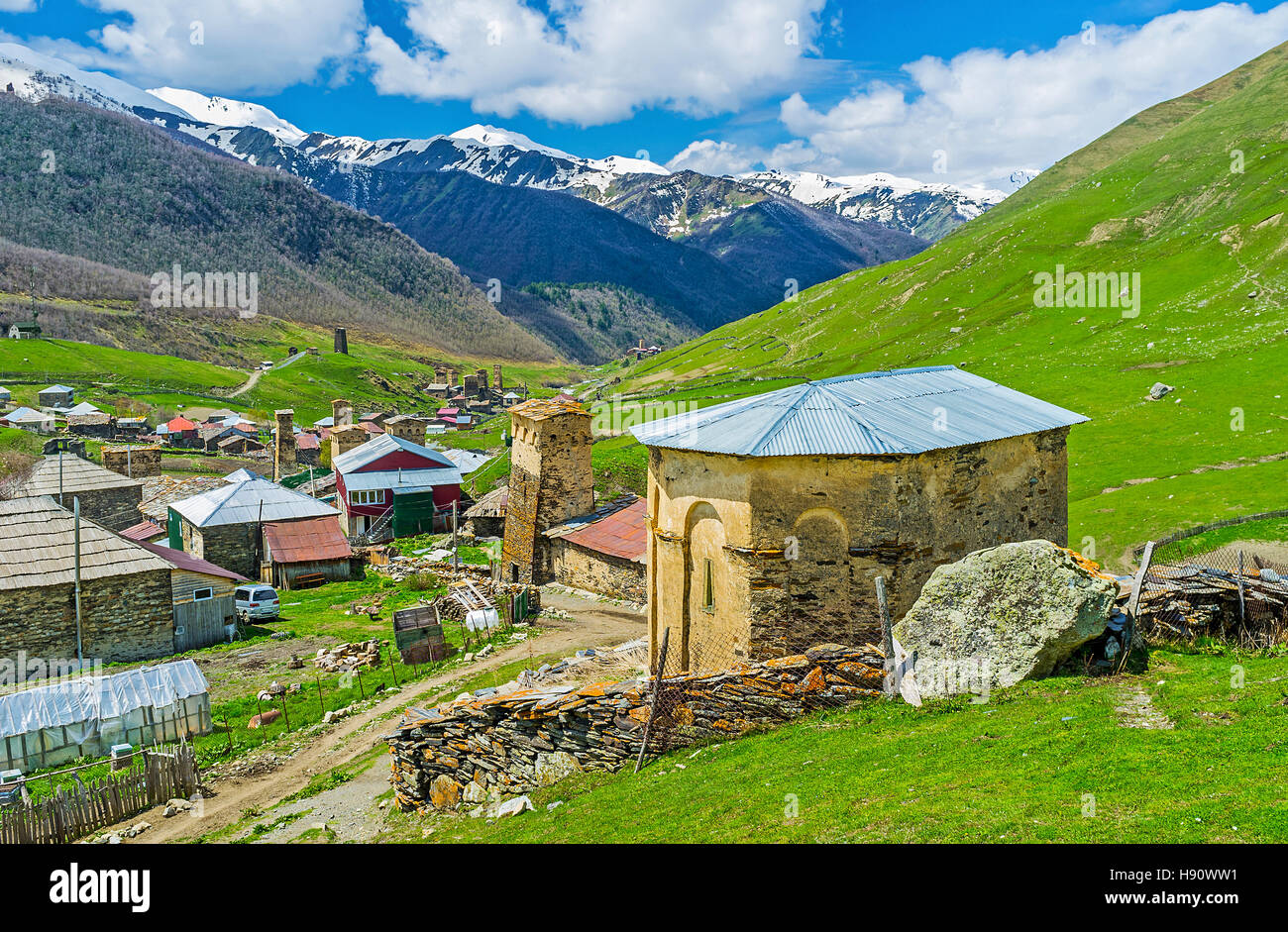 The view from the hill on the old St George Church and preserved medieval Svan towers of Ushguli, Upper Svaneti, Georgia. Stock Photo