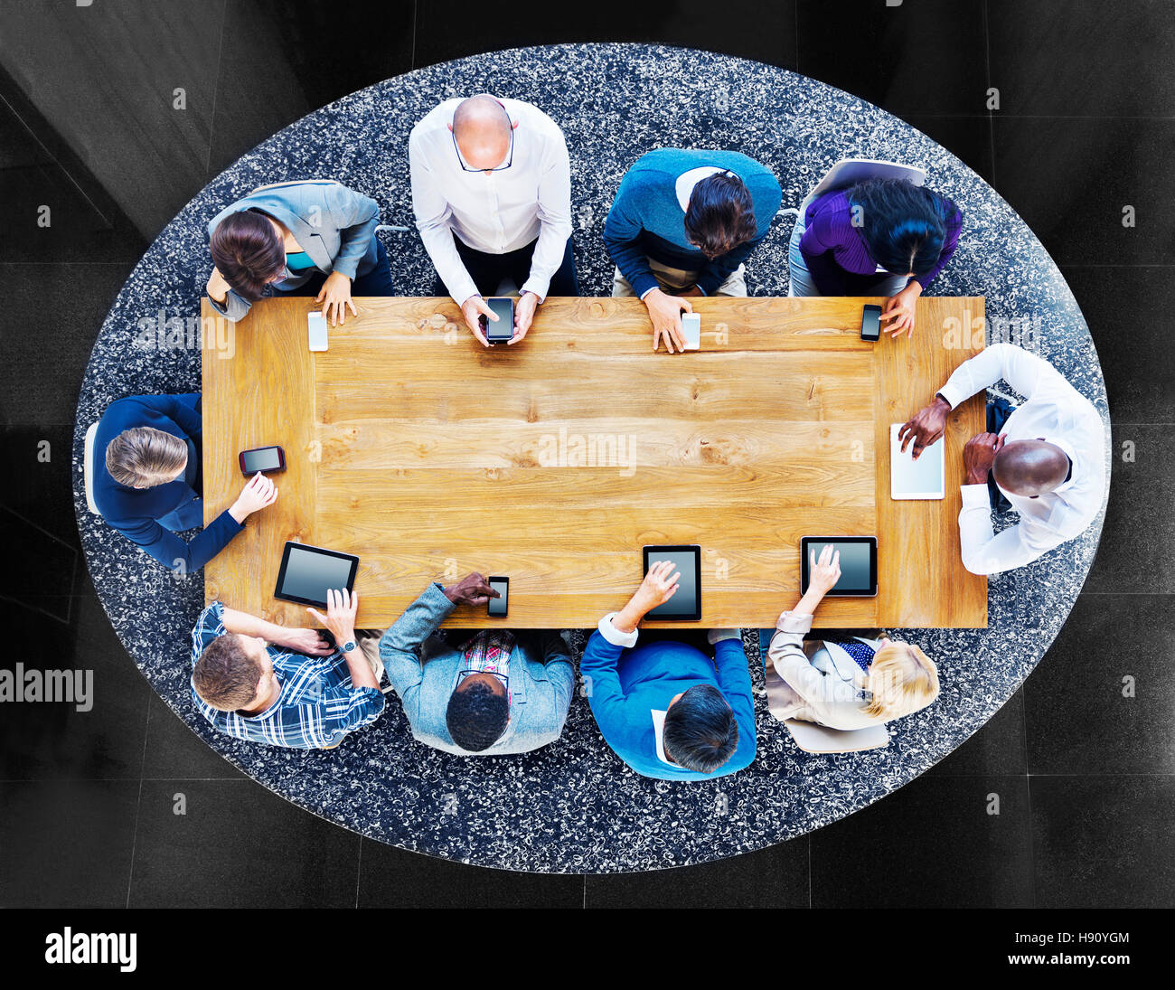 Group of Diverse People in a Table Using Devices Concept Stock Photo ...