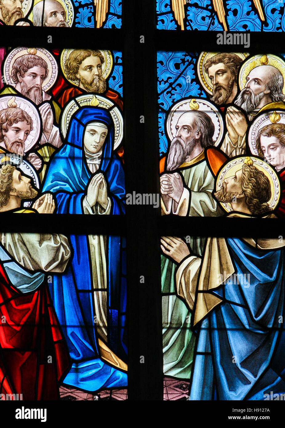Stained Glass window depicting Mary and the Apostles on Pentecost in the Church of Alsemberg, Belgium. Stock Photo