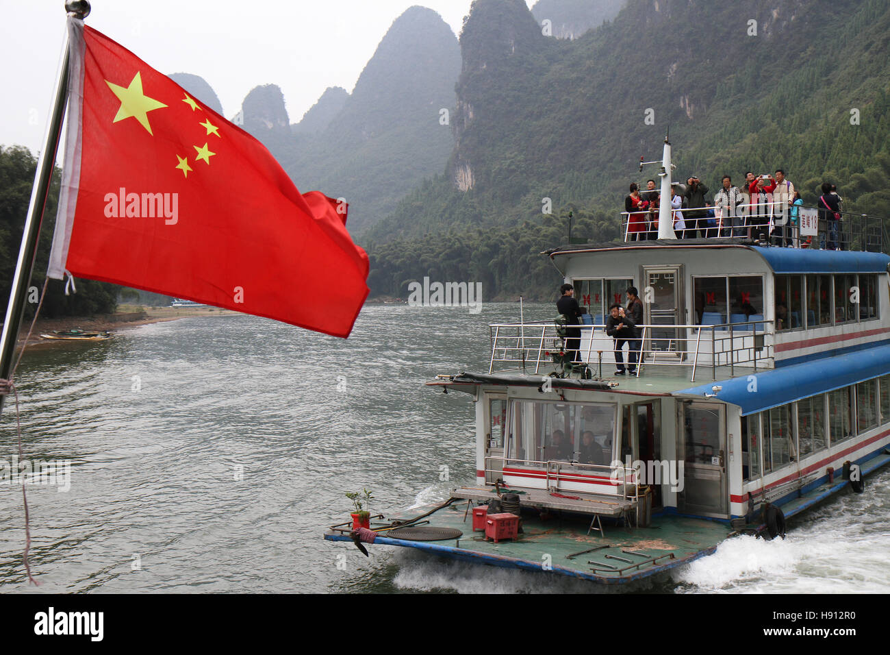 Li River in China river boats, with Karst mountains in the distance. Stock Photo