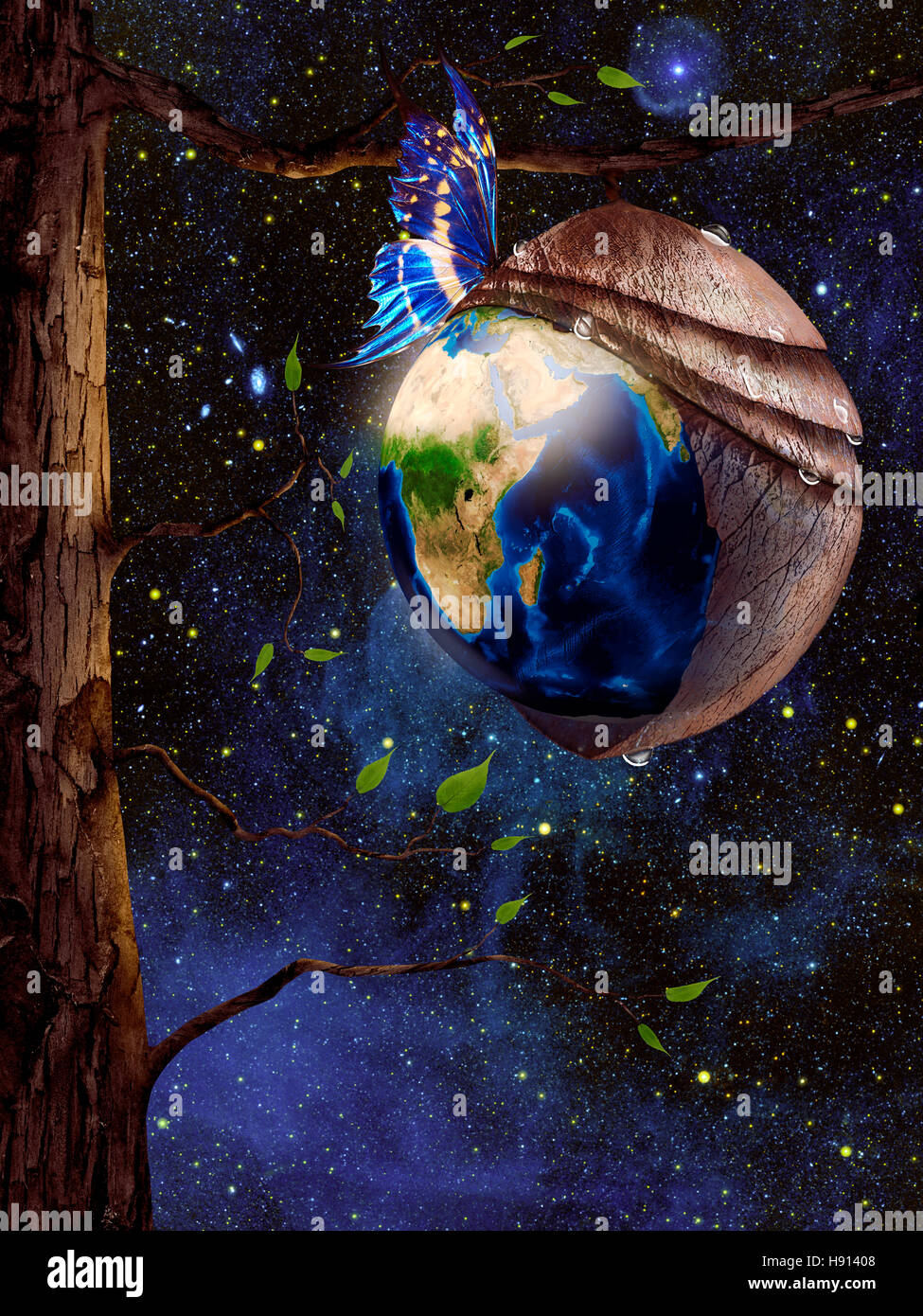License and prints at MaximImages.com - New planet Earth reborn from butterfly cocoon hanging from a tree in cosmic space, conceptual spiritual zen ph Stock Photo