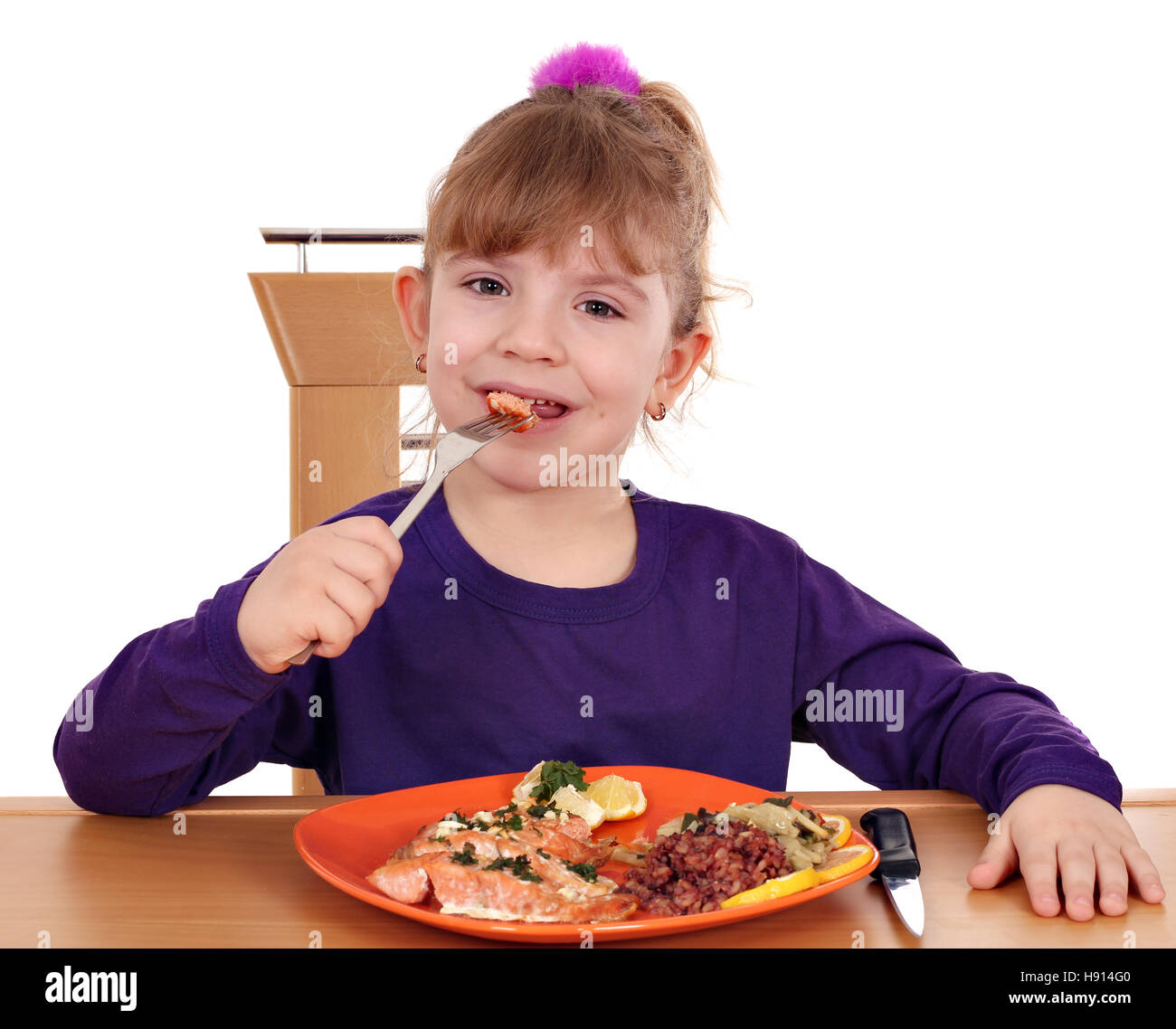 Little cute girl eating lemon hires stock photography and images Alamy