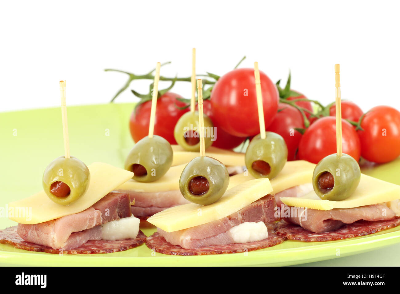 ham cheese olives and tomatoes buffet food Stock Photo