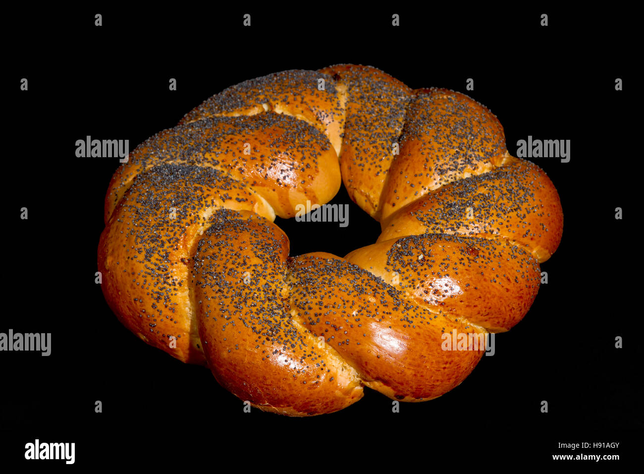buns with poppy seeds isolated on black background Stock Photo