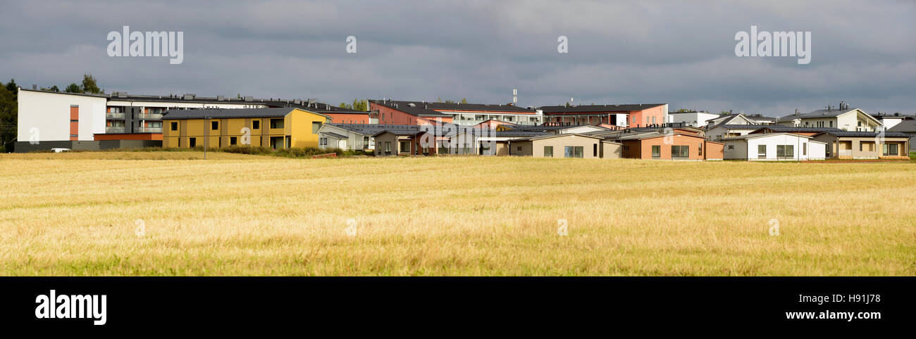 urban area next to the field in autumn, panorama Stock Photo