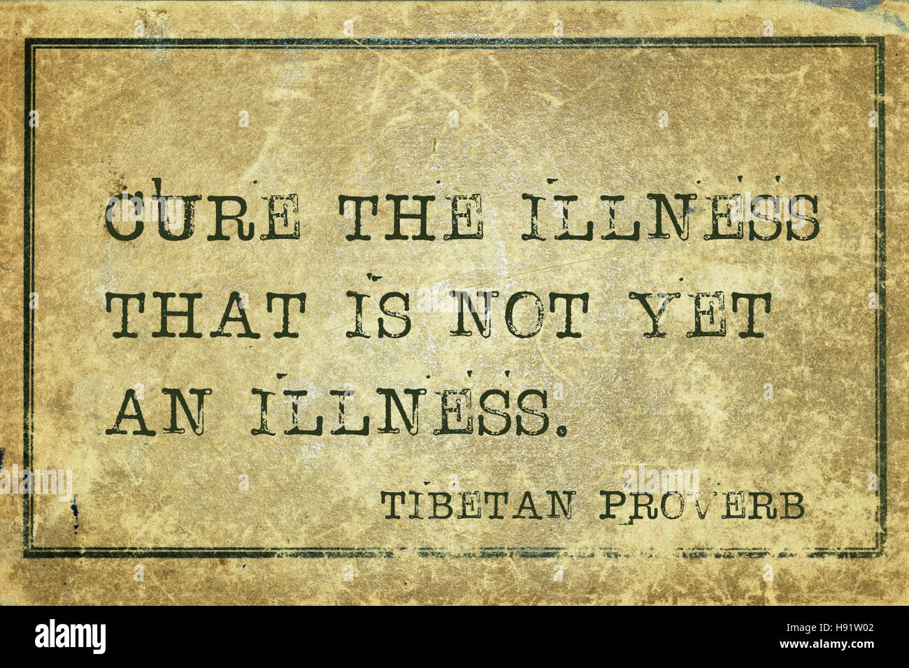 Cure the illness that is not yet  - ancient Tibetan proverb printed on grunge vintage cardboard Stock Photo