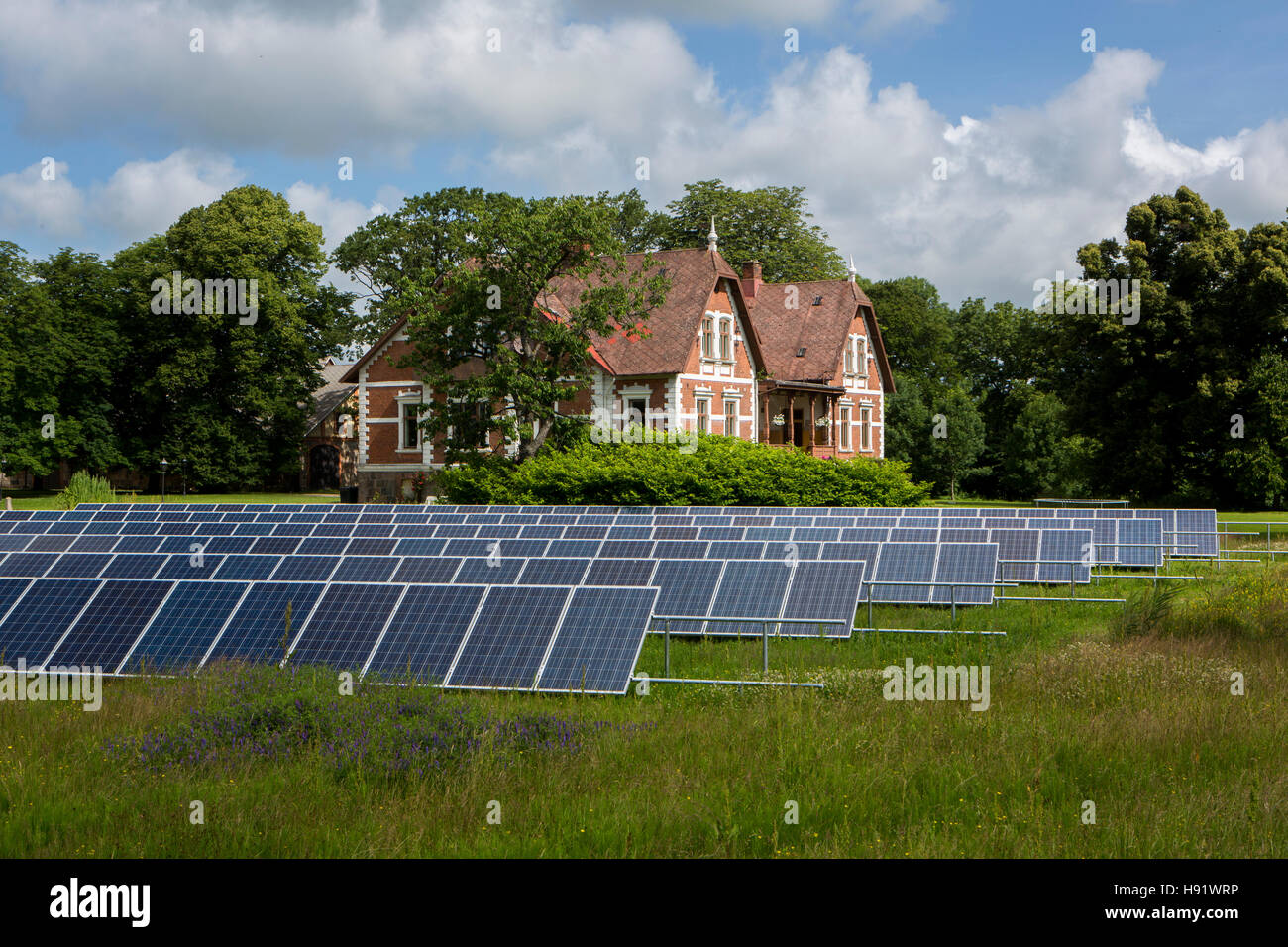 Solar power plant in a field in Skåne, Sweden. Stock Photo