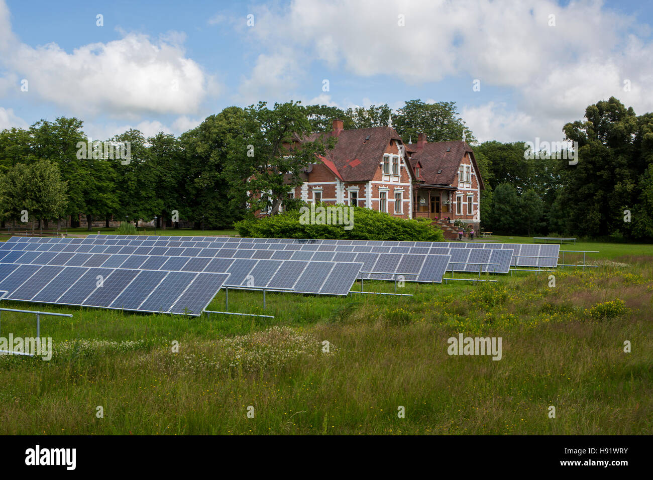 Solar power plant in a field in Skåne, Sweden. Stock Photo
