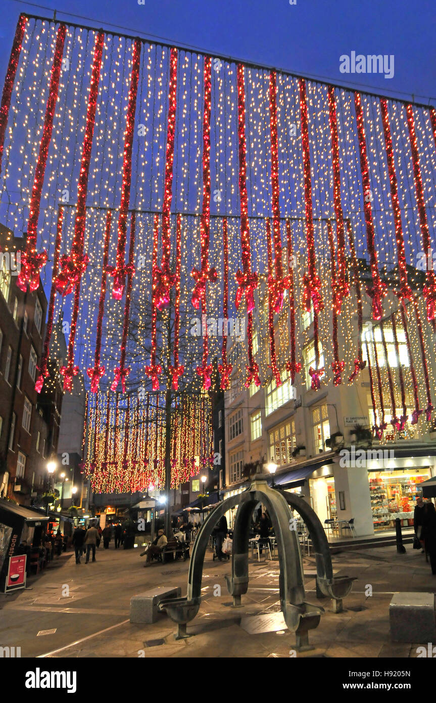 Christmas decorations London West End shopping eating out area many outdoor café & outside restaurant in St Christophers Place just off Oxford Street Stock Photo