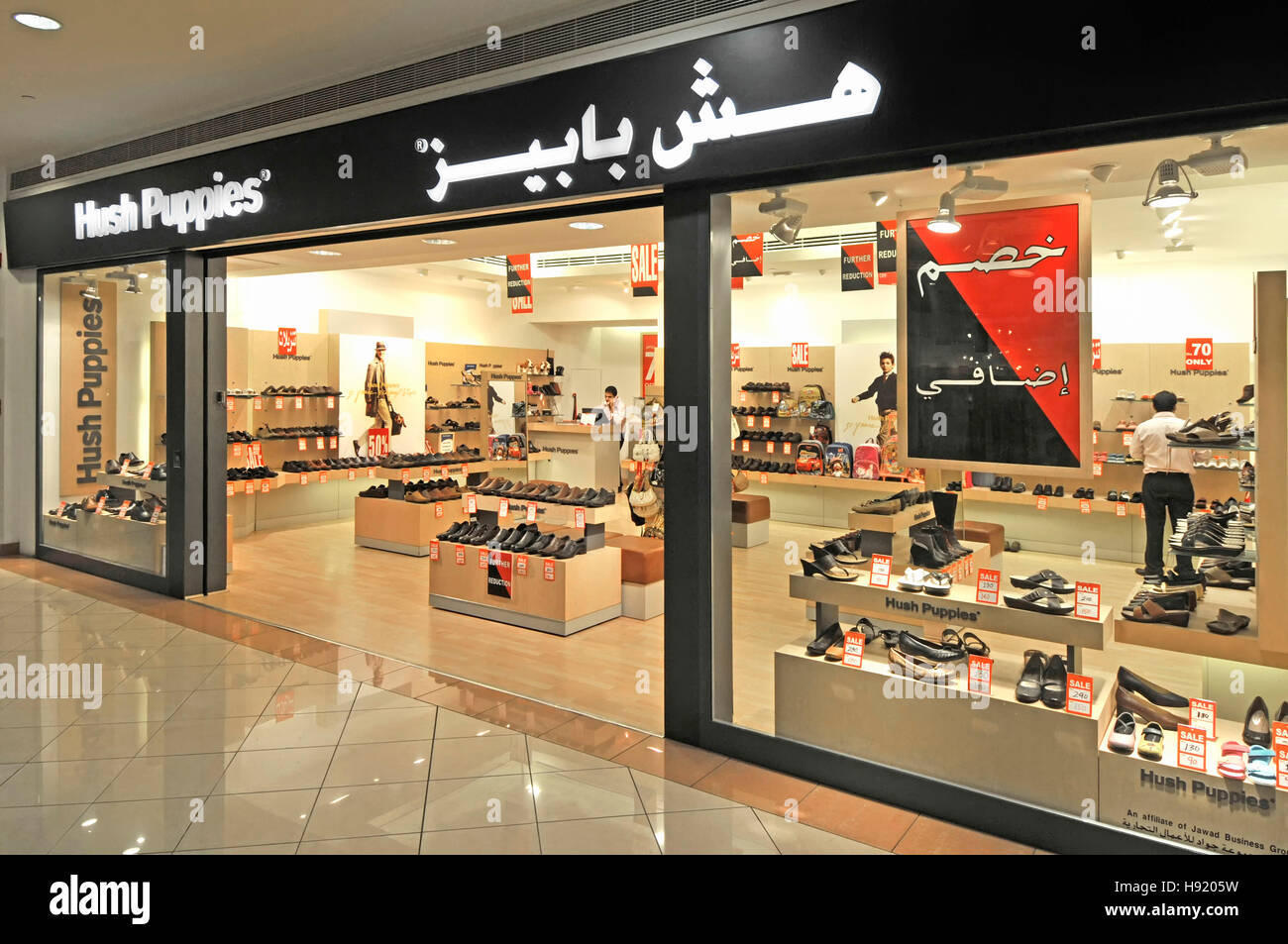 Shop in Abu Dhabi UAE middle east Marina shopping mall Hush Puppies brand  shoe shopping front window display interior with bilingual multilingual  sign Stock Photo - Alamy