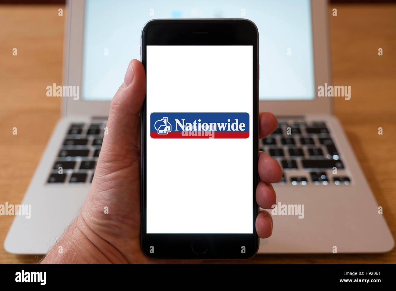Using iPhone smart phone to display website logo of Nationwide British mutual financial institution Stock Photo