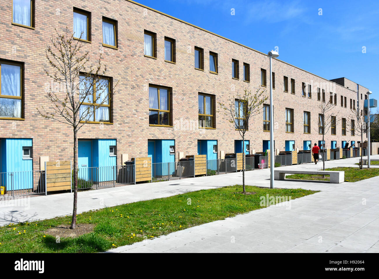 Front view of long row of modern terraced town houses in a residential street part of new Barking Riverside development East London England UK Stock Photo
