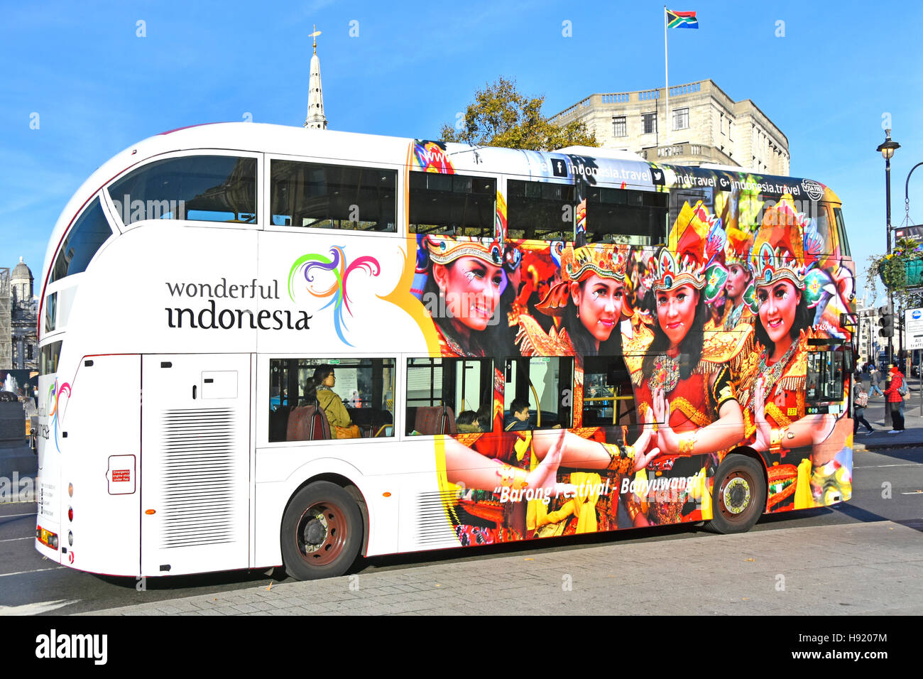 London double decker bus Indonesia tourism graphic design advertising & promoting Barong Festival in Banyuwangi Java side London Boris bus England UK Stock Photo