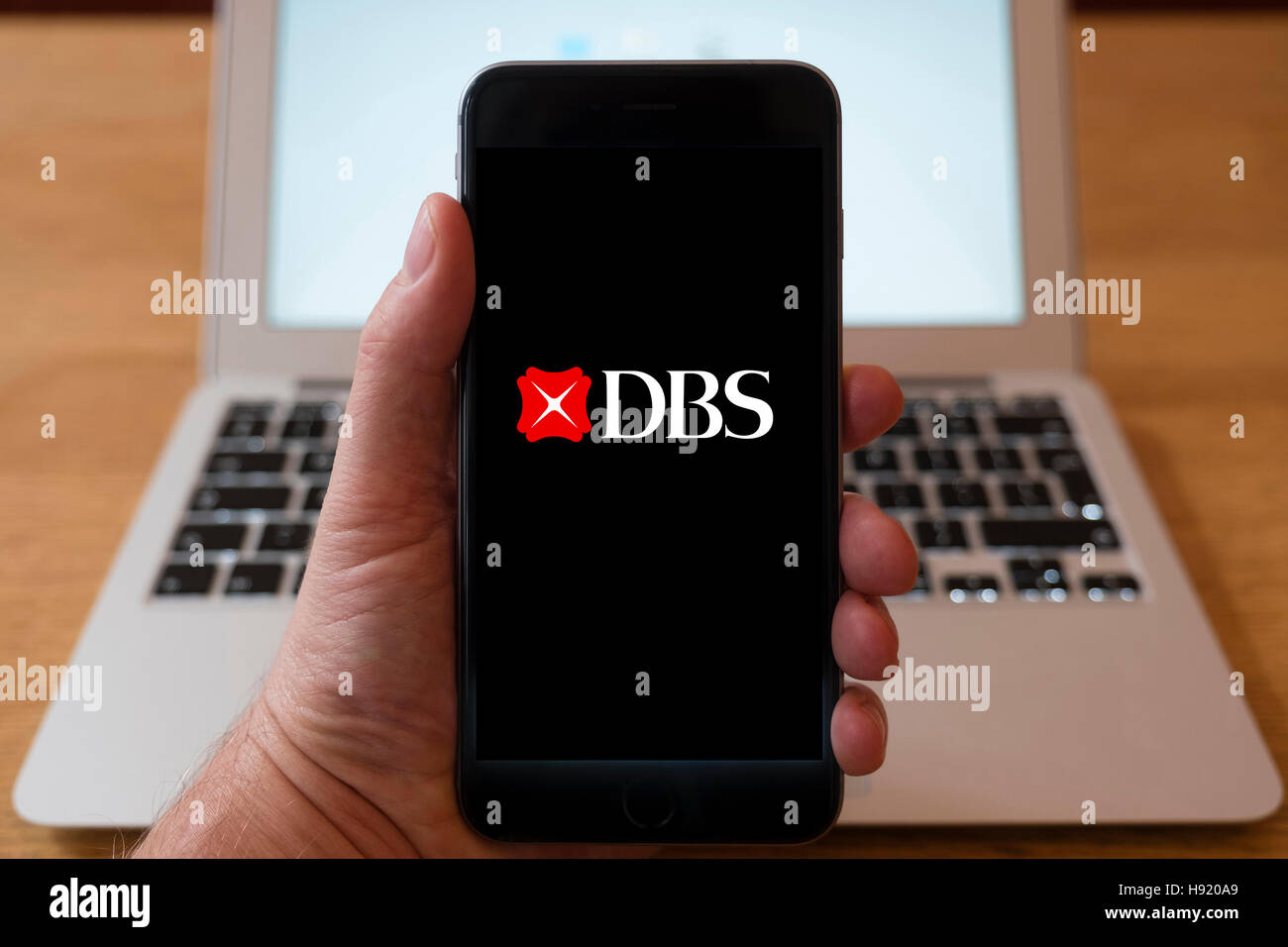 Using iPhone smart phone to display website logo of DBS, a Singaporean multinational banking and financial group Stock Photo
