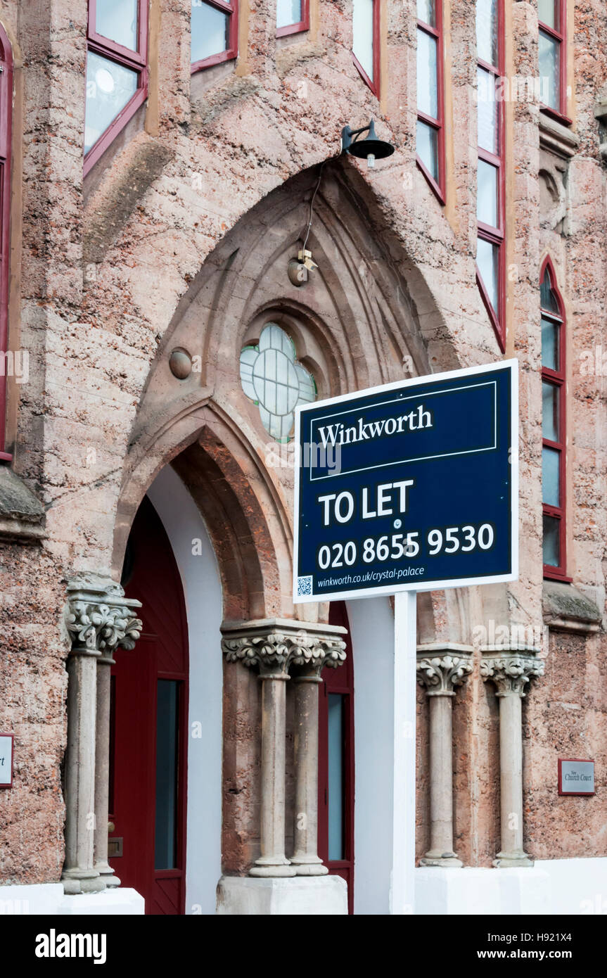 To Let sign outside concrete New Church in Anerley, South London. Built ...
