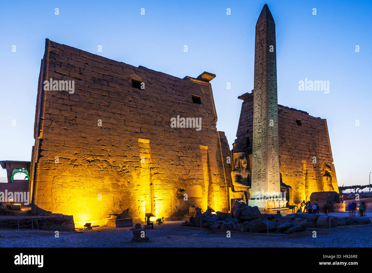 The obelisk and statue of Ramesses II at the entrance to Luxor Temple. Stock Photo