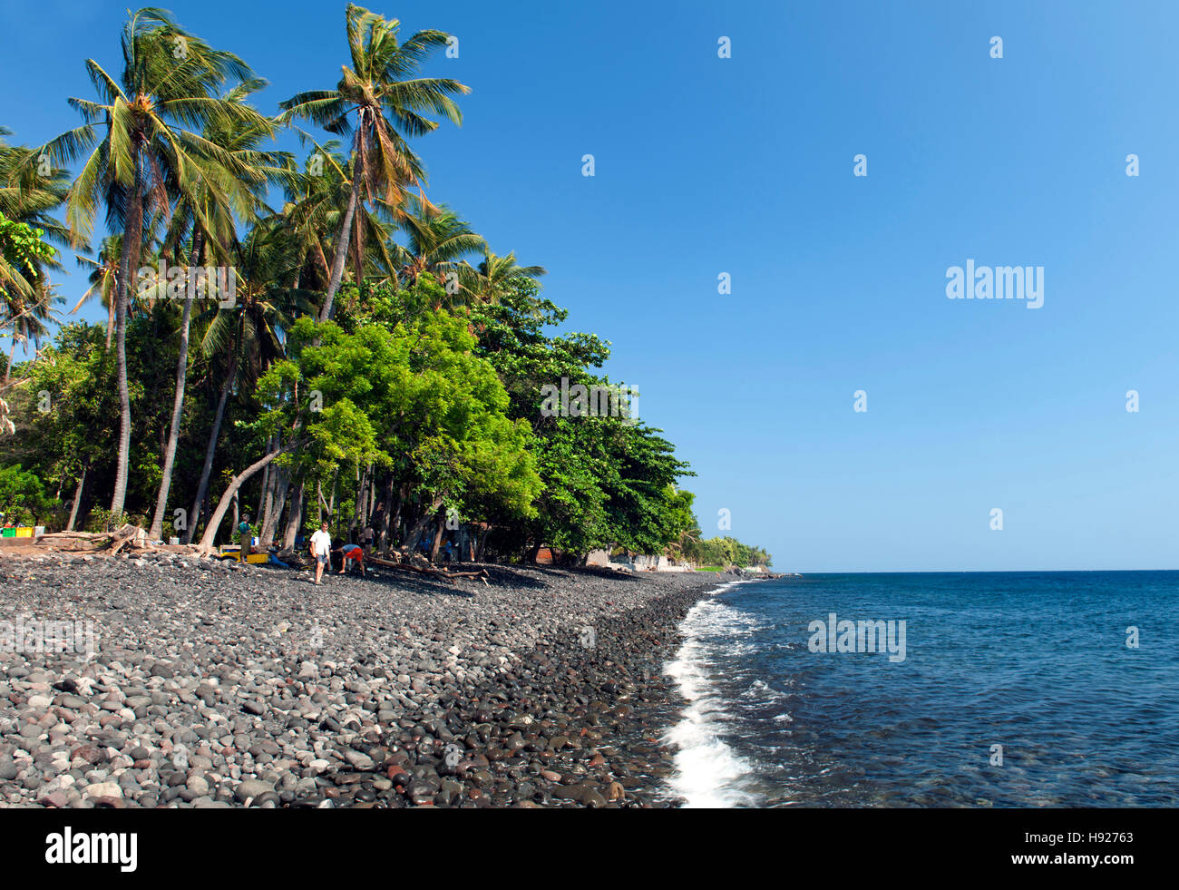 The rocky beach at Tulamben near Amed on the northeastern coast of Bali in Indonesia. Stock Photo