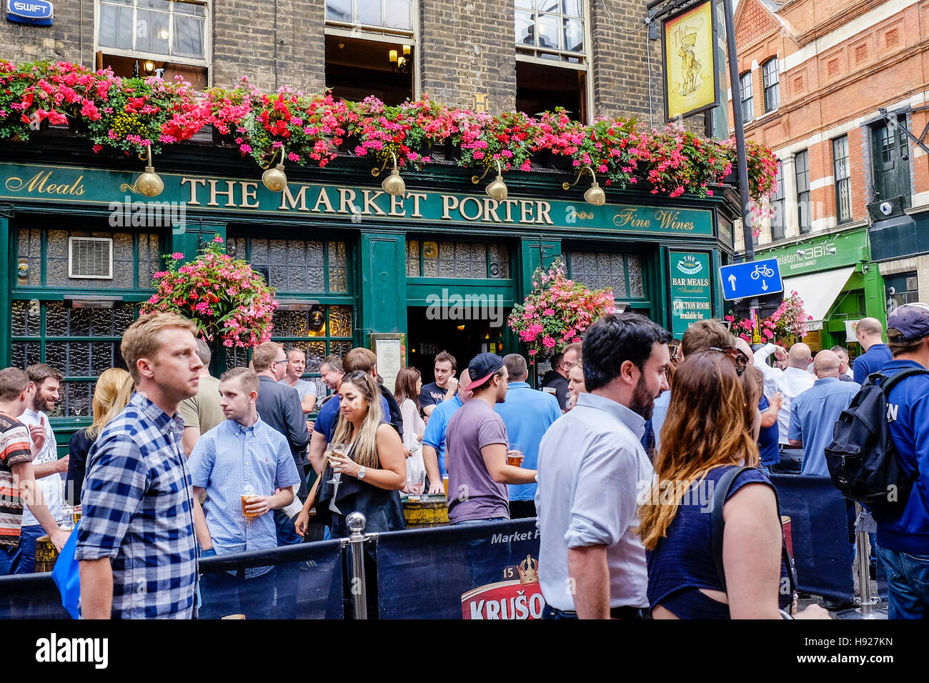 People drinking outside The Market Porter public house at Borough Market in London. Stock Photo