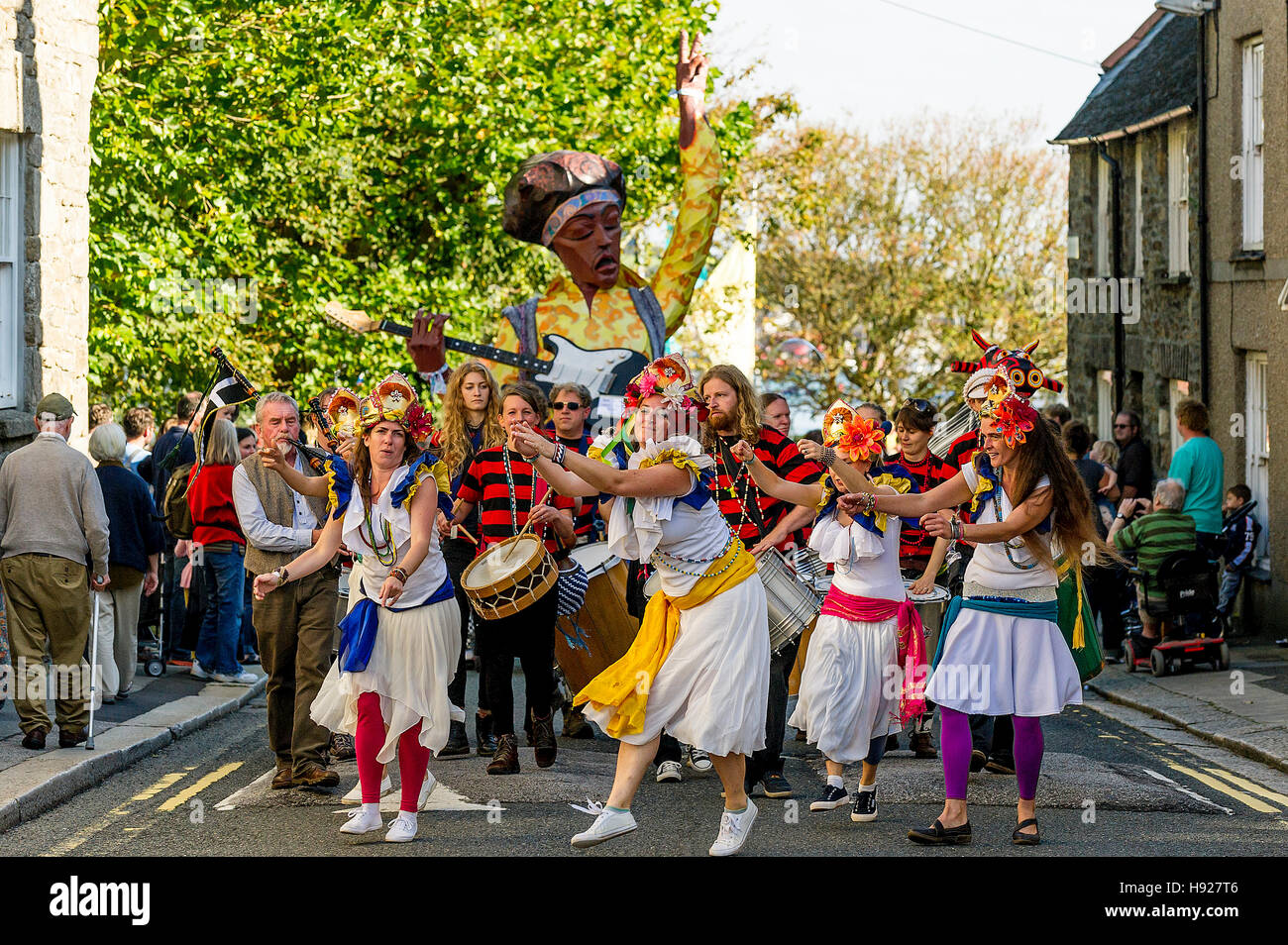 Dakadoum Samba Band and dancers take part in the Penryn Festival in Cornwall. Stock Photo
