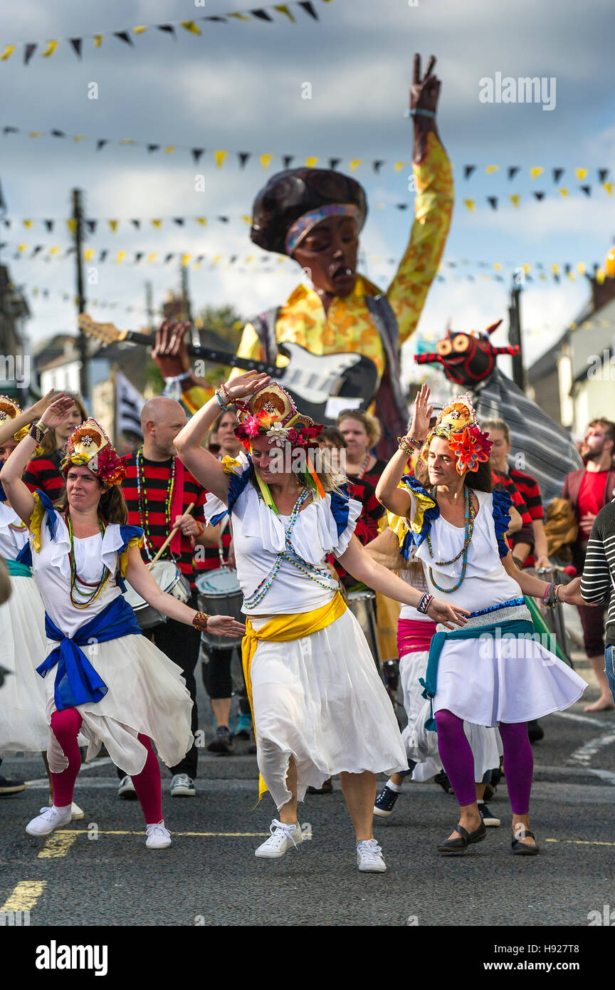 Dakadoum Samba Band and dancers take part in the Penryn Festival in Cornwall. Stock Photo