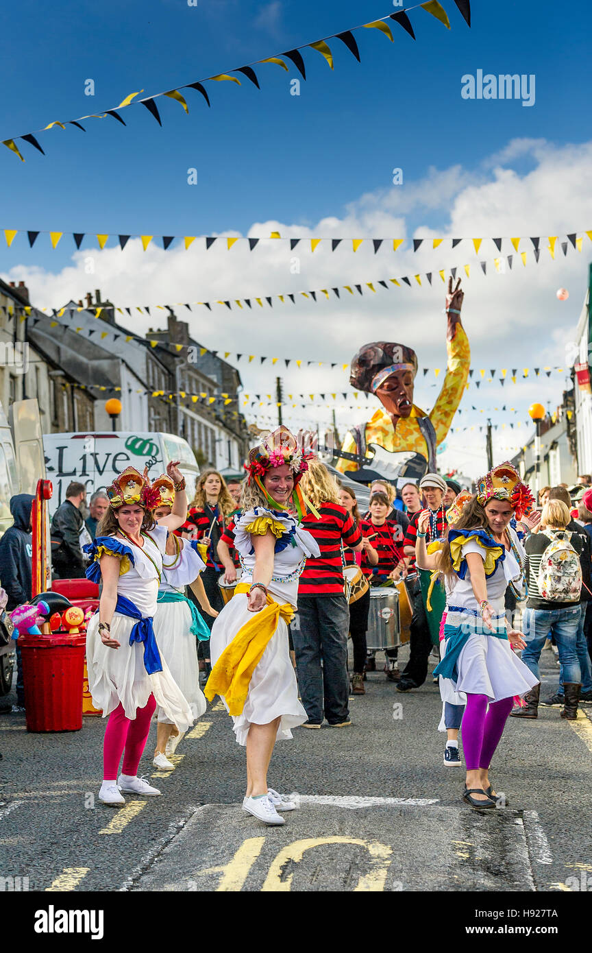 Dakadoum Samba Band and dancers take part in the Penryn Festival in Cornwall. Stock Photo
