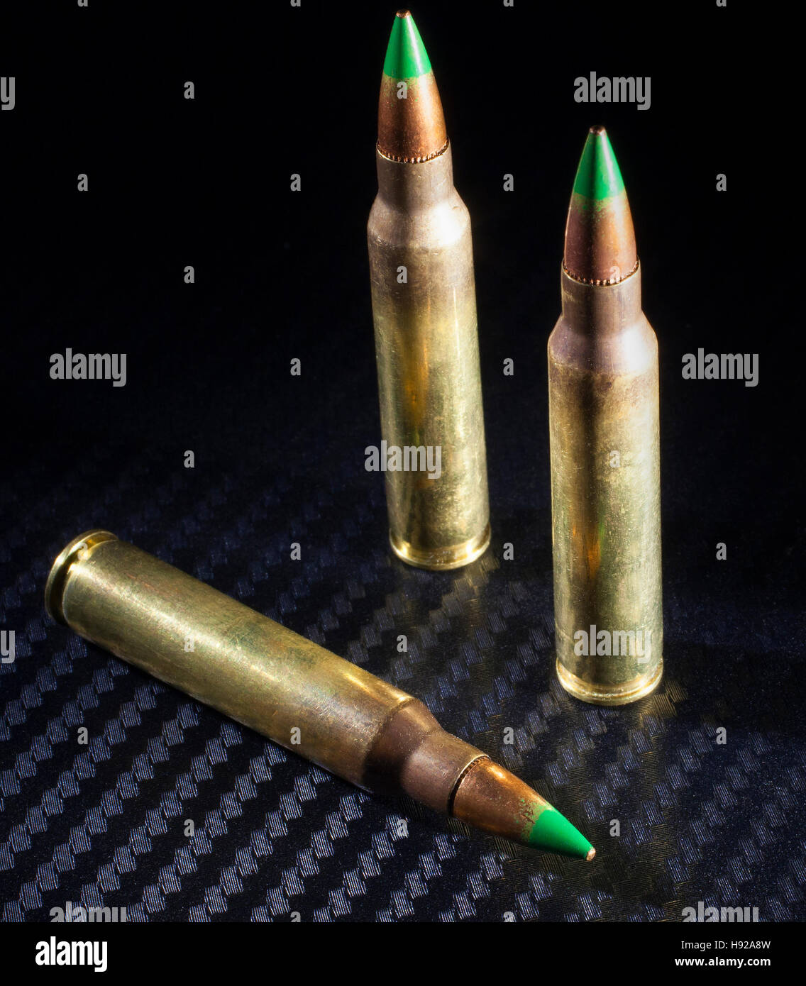 Three green tipped cartridges considered to be armor piercing Stock Photo Alamy