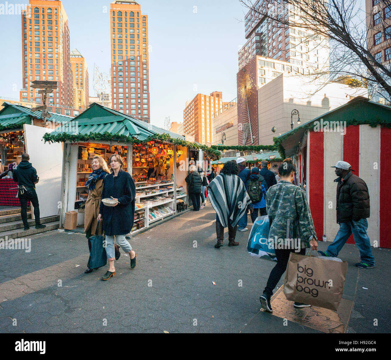 Shoppers browse the Union Square Holiday Market in New York on opening day, Thursday, November
