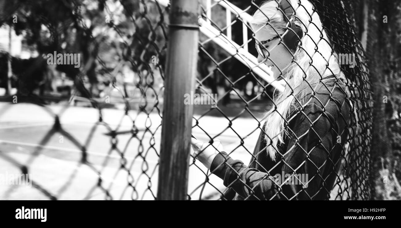 Young Woman Skater Browsing Phone Concept Stock Photo