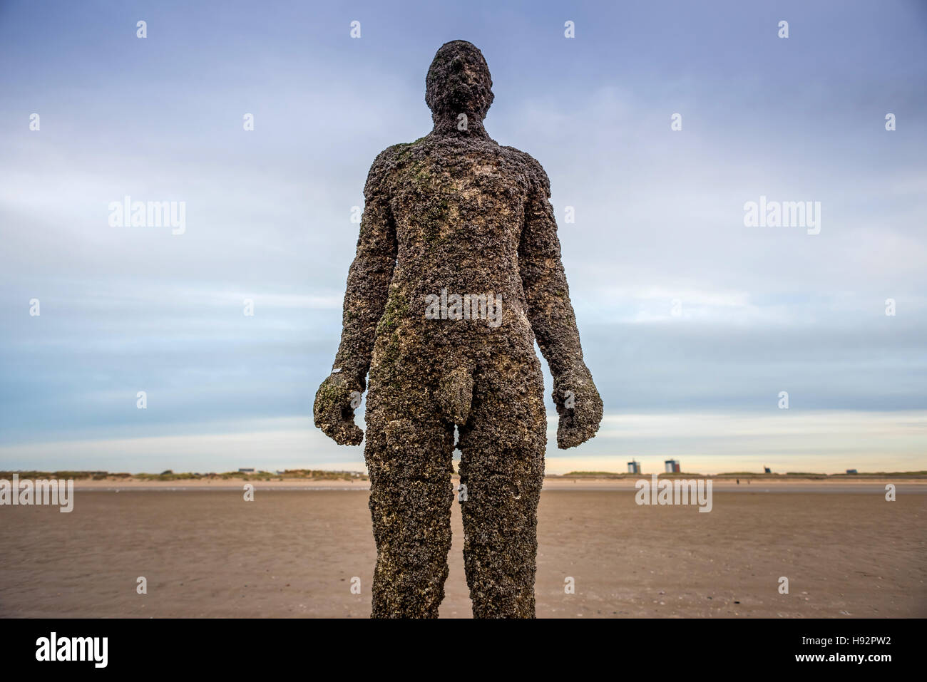 Anthony Gormley's art installation 'Another Place' at Crosby beach in Liverpool. Stock Photo
