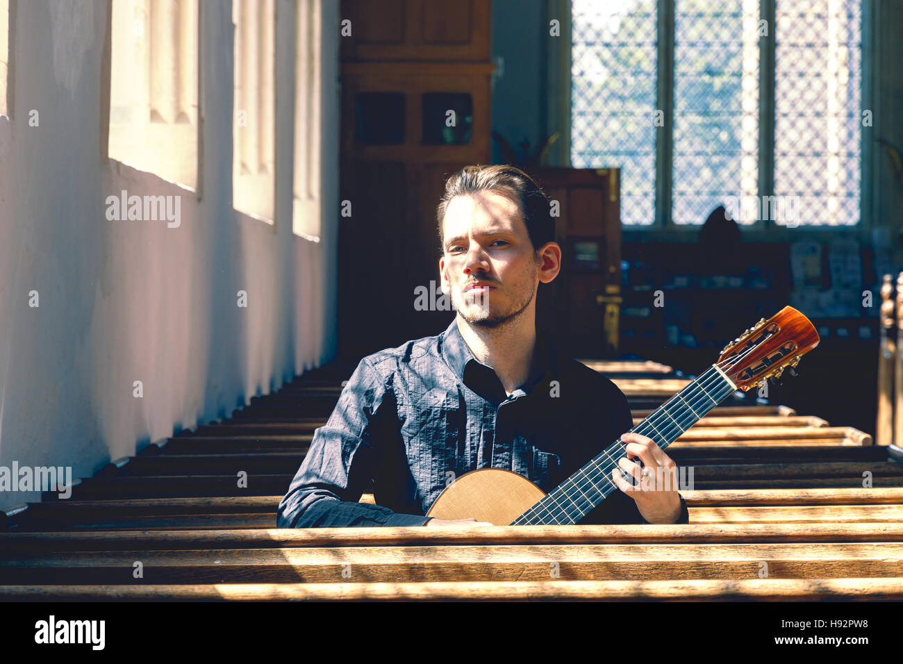 Young male classical musician with a guitar Stock Photo